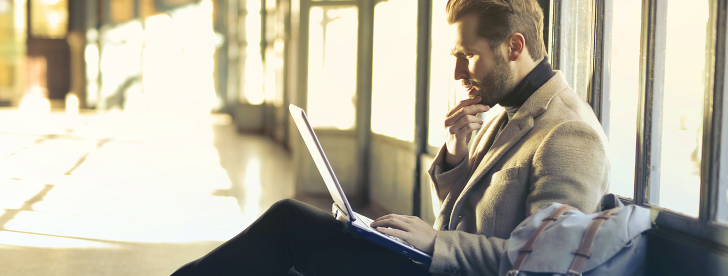 Photograph of a sales leader looking at a laptop