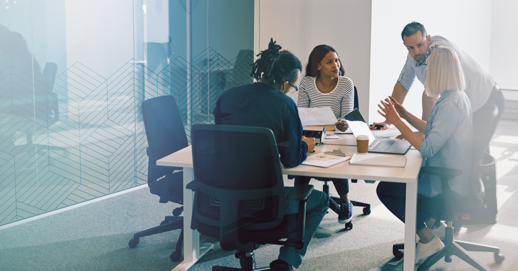 Photograph of a diverse group of salespeople engaging in sales collaboration and talking at a table