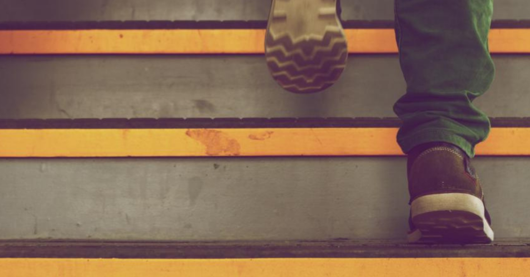 Shoes of someone walking up stairs