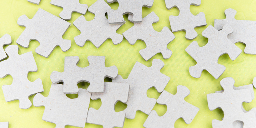 Photograph of cardboard puzzle pieces