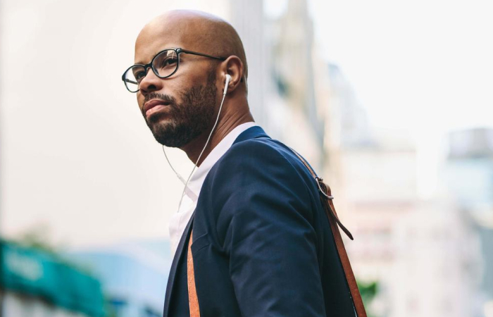 Man commuting wearing headphones